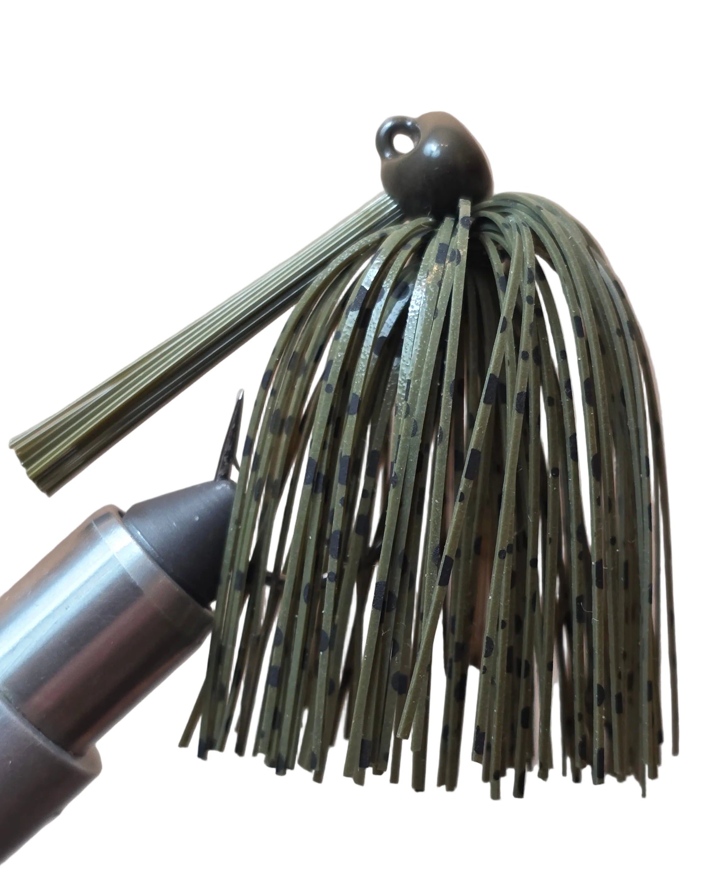 Fishing lure with a green and black speckled detail